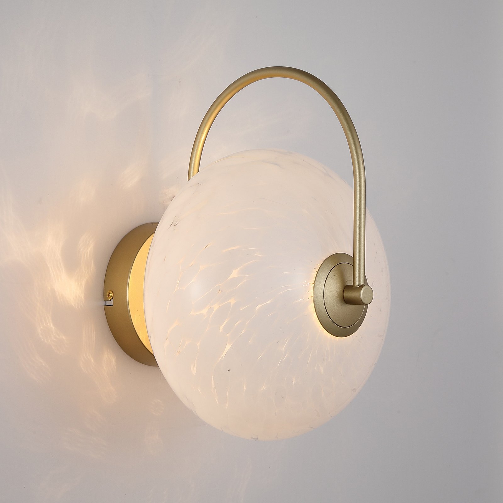 LED sienas lampa Confetti, zelta krāsā/balta, platums 25 cm, stikls