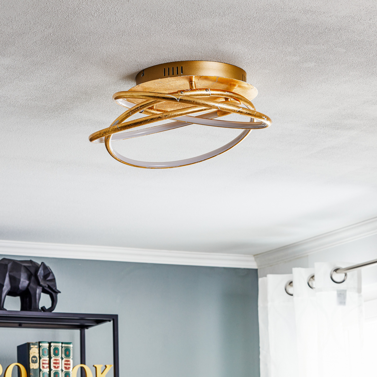 Barna - an LED ceiling lamp in a golden design