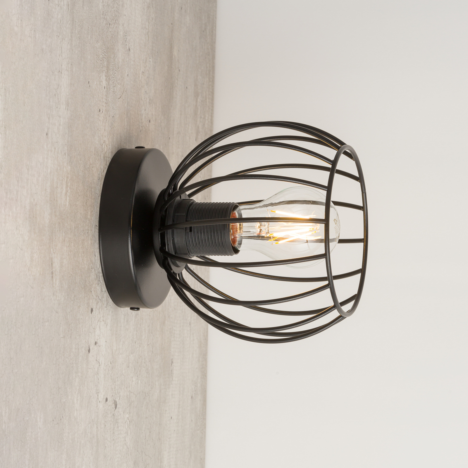 Nele wall light, black, with a cage lampshade