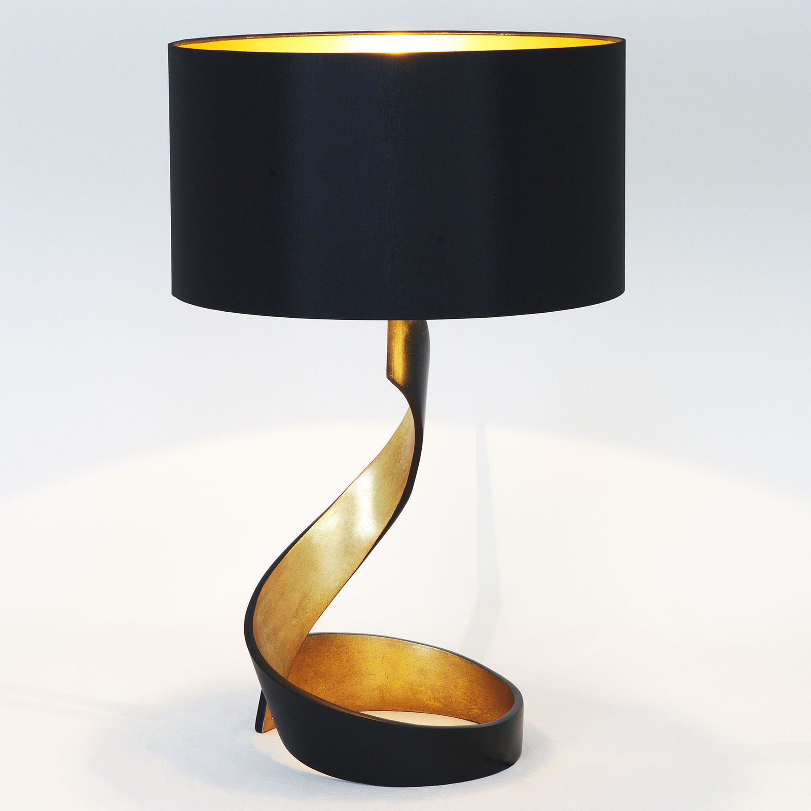 Stolní lampa Vortice, černo-zlatá