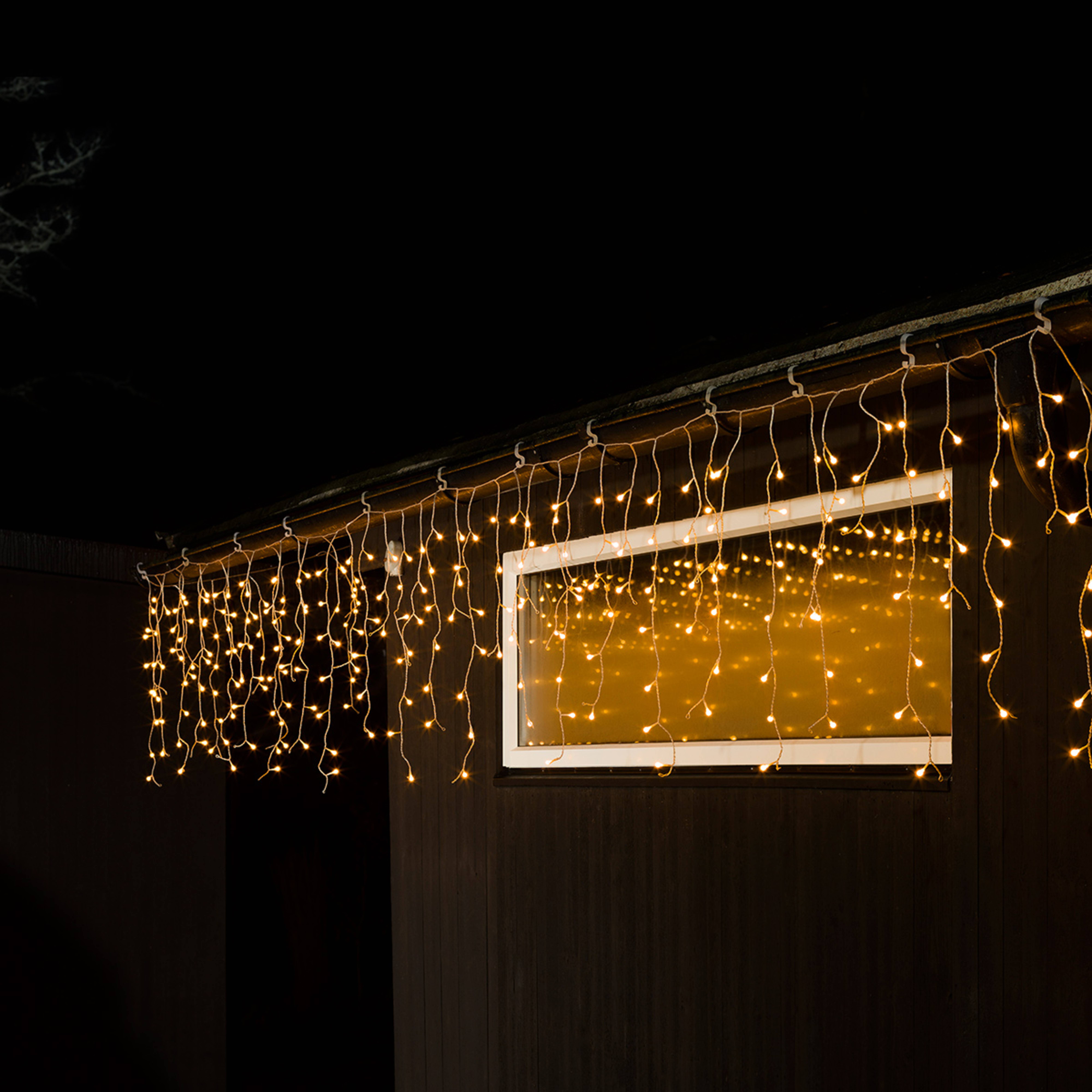 Cortina de luces LED lluvia de hielo blanco cálido transp. 10m