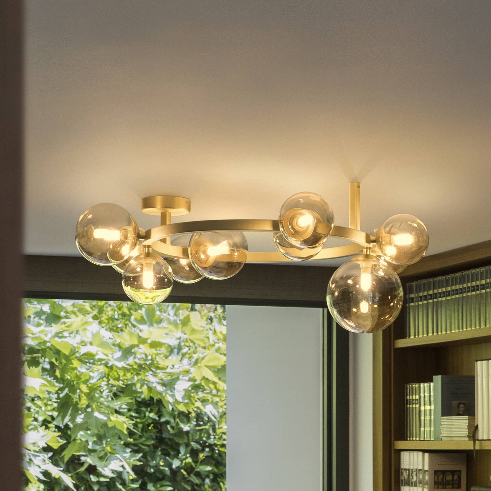 Plafonnier IDEAL LUX Perlage, laiton/ambre, longueur 70 cm, à 10 lampes