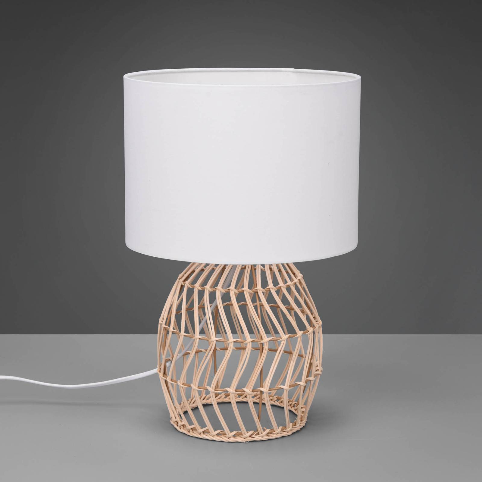 Reality Leuchten Rike table lamp, rattan frame and fabric lampshade