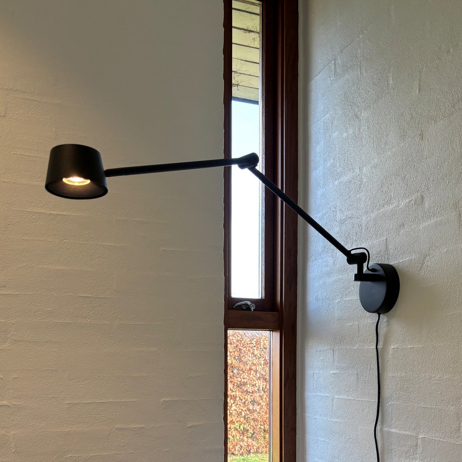 Direction LED-Wandlampe, schwarz, Ausladung 53 cm - Antidark