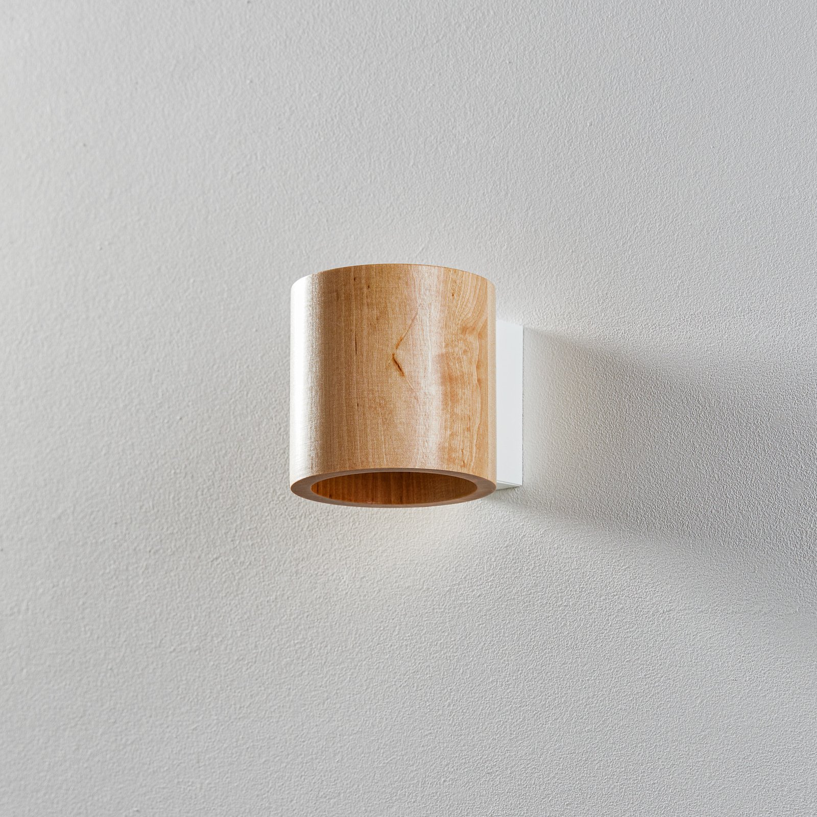 Ara wall light as a wooden cylinder