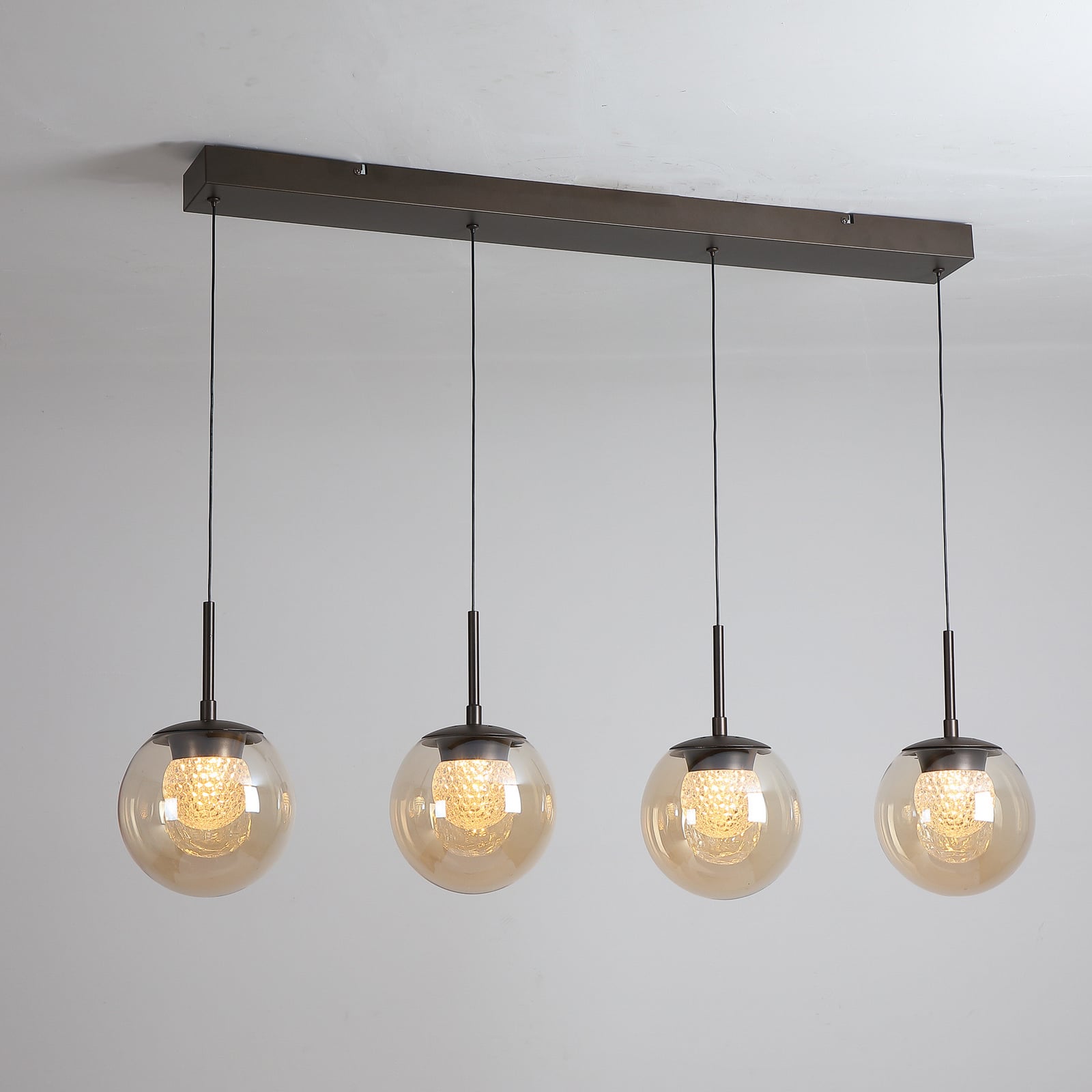LED-Hängeleuchte Solis, 4-fl. lang, bronze, Glas, 2.700 K LED-Hängeleuchte Solis, 4-fl. lang, bronze, Glas, 2.700 K
